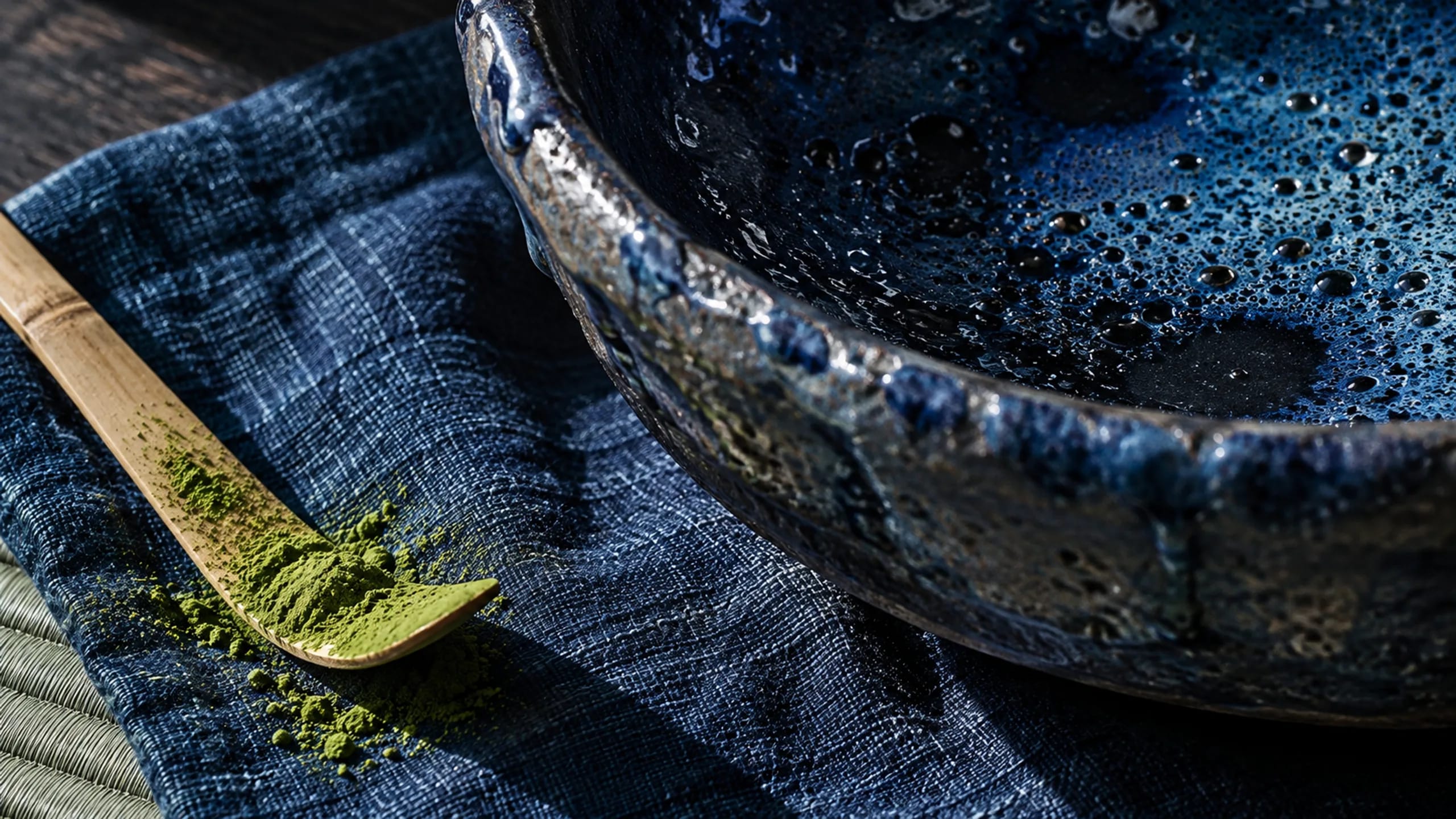 Kumo branded detail artwork: An indigo noren and afternoon tea in a Kyoto ryokan